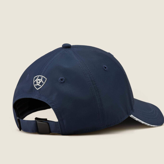 Navy baseball cap with brand logo on a beige background