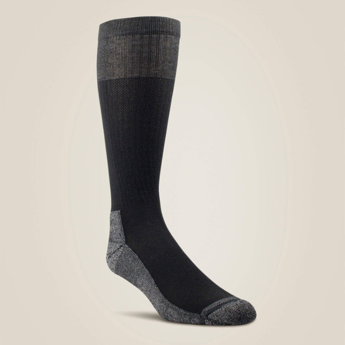 Black knee-high sock with grey accents on a beige background