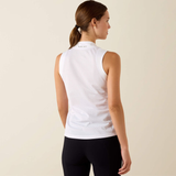 Female model with white sleeveless v neck top on cream background reverse view