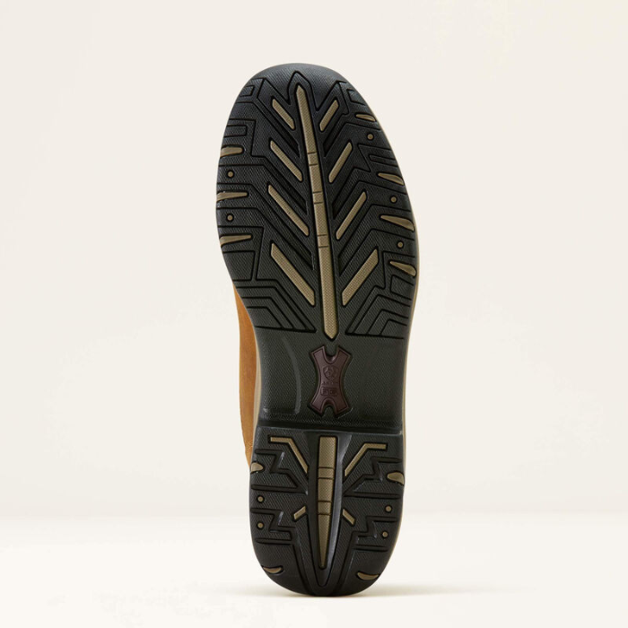 Close-up of a shoe sole with a textured pattern on a light beige background