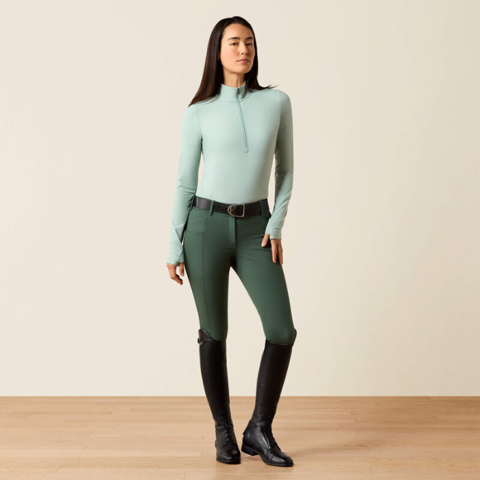 Soft green base layer with green leggings on a beige background