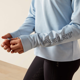 Light blue long-sleeve shirt with 'ARIAT' branding on a neutral background