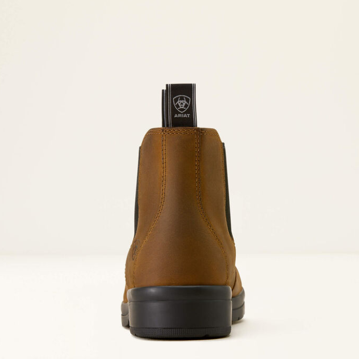 Brown leather boot with black sole on a white background