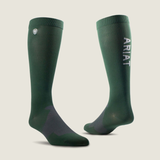 Two green Ariat socks on a light grey background