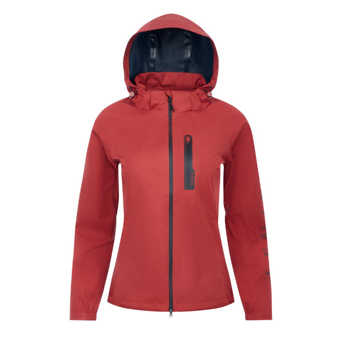 LeMieux AW26 Athena Waterproof Lightweight Jacket Varient Russet. A red hooded waterproof jacket with a full front zipper, a vertical zippered chest pocket, and a dark navy interior hood lining, shown on a plain white background.