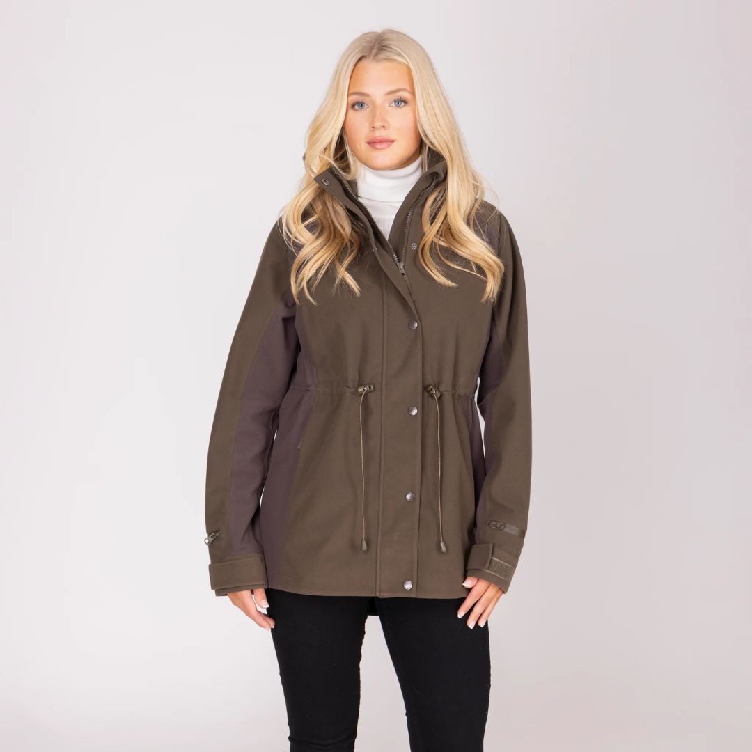 Woman wearing a brown jacket on a white background