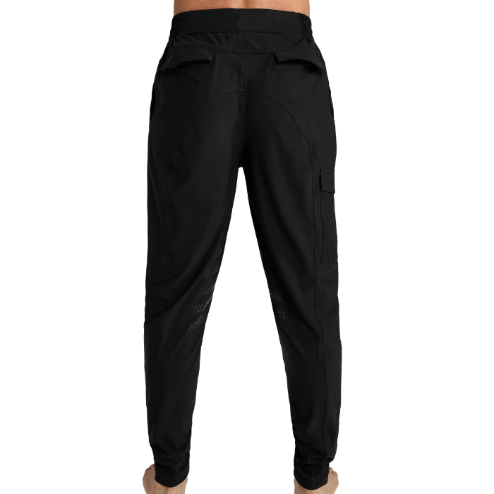 Male figure wearing black training pants  view from behind white background