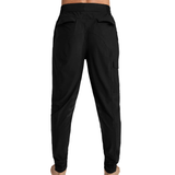 Male figure wearing black training pants  view from behind white background