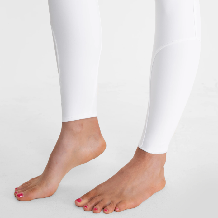 White leggings worn by a person on a white background
