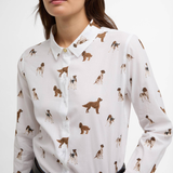 White shirt with variety of dogs printed on a white background