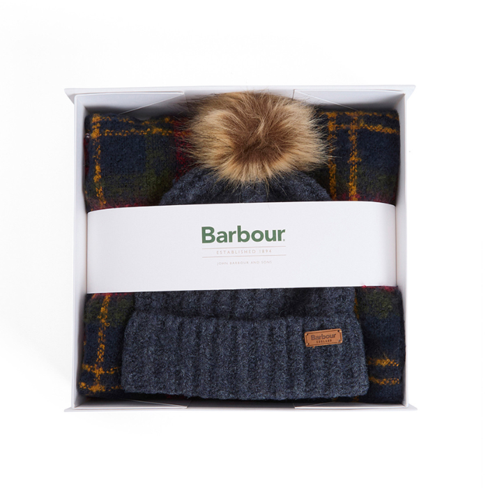 Plaid blanket with knit beanie and pom-pom in a Barbour branded box.