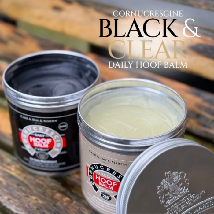 2 hoof care products black and cream with silver lid on faded background