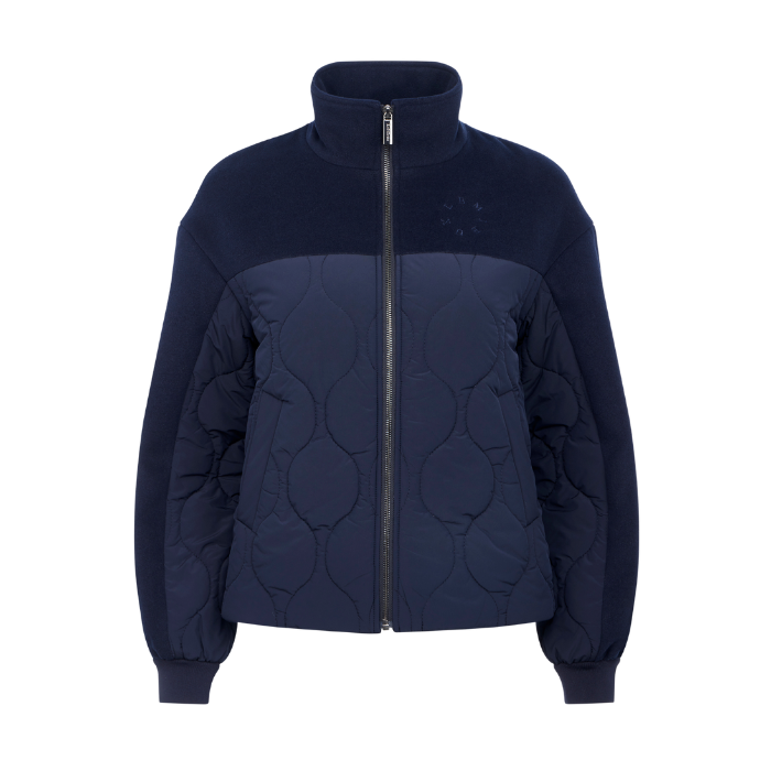 LeMieux AW26 Chloe Bomber Jacket Varient Navy. A navy blue zip-up jacket with a quilted circular pattern on the front and smooth fabric on the upper body and sleeves, shown against a plain white background.