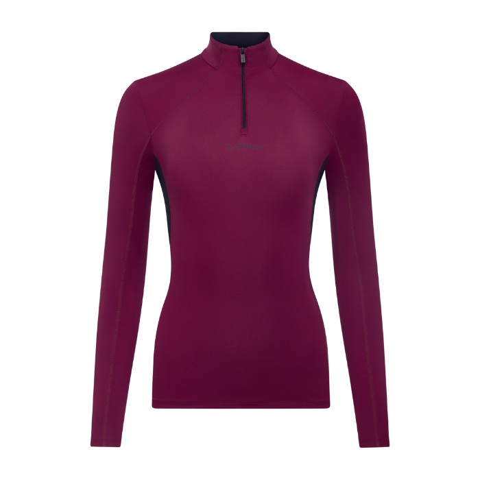 LeMieux AW26 Classique Base Layer Variant Colour Blackberry.
A women's long-sleeve quarter-zip performance top, featuring a mock neck, black zipper, and subtle dark side paneling, shown on a plain white background.