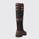 Dark brown country boot with leather straps on a light grey background