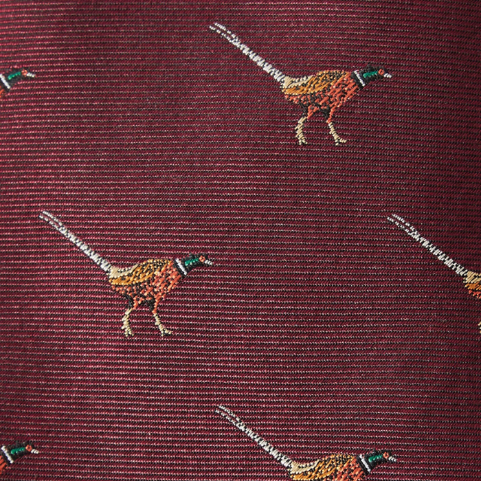 Patterned tie with pheasant design on a maroon background