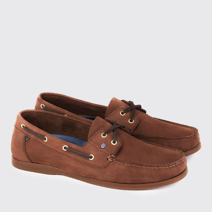 Pair of light brown deck shoes on a light grey background