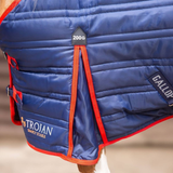 Blue quilted horse blanket with Trojan and Gallop branding on a blurred background