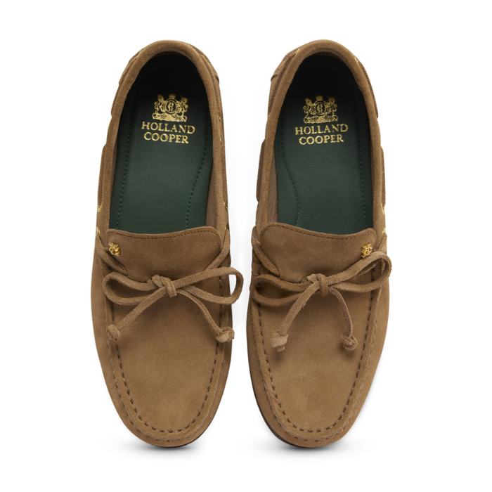 Pair of brown suede shoes with 'Holland Cooper' branding on a white background