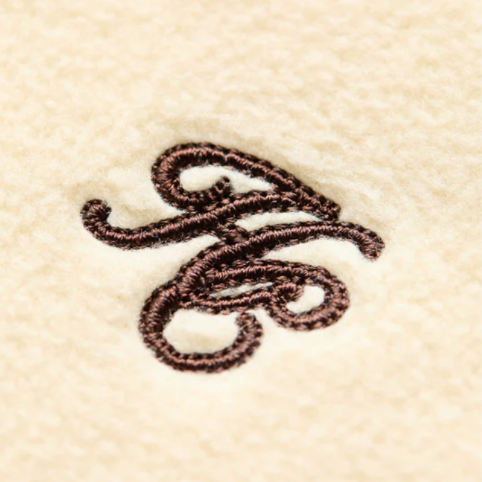 Cream fleece material with HC embroidery