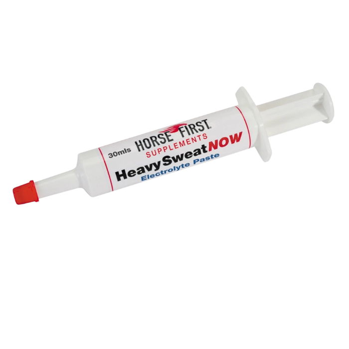 White syringe horse paste with red lid on white background