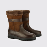 Pair of brown winter boots with fur lining on a light grey background