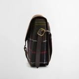 Tartan bag with leather strap and gold buckle on a light grey background