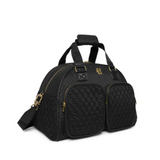 Black quilted bag with gold accents on a white background