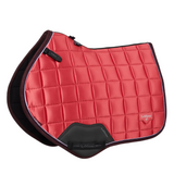 Red quilted saddle pad with black border on a white background