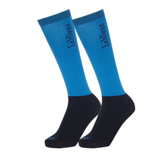 Blue and black long riding socks on a white background