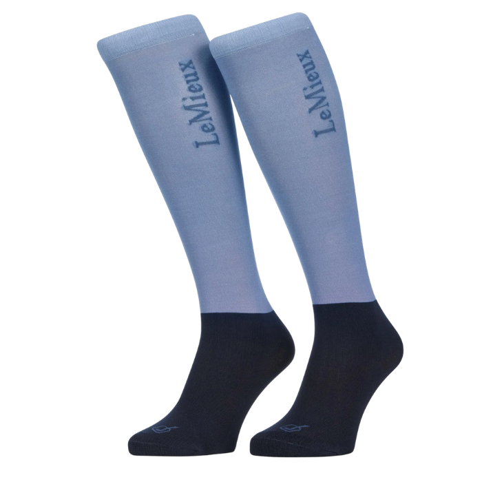 Pair of light blue knee-high socks with black toes and heels on a white background