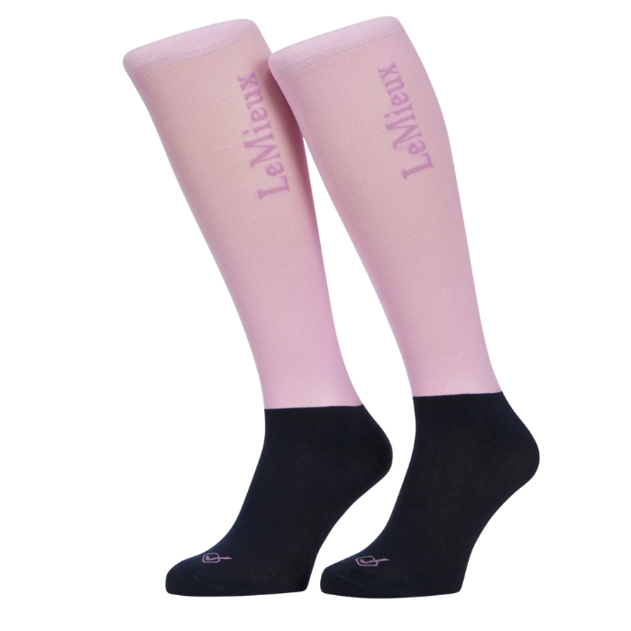 Pair of light pink knee-high socks with LeMieux branding on a white background