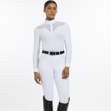 Woman wears the LeMieux Emily Long Sleeve Show Shirt in White with white breeches