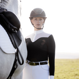 Woman stands by horse wearing LeMieux Emily Short Sleeve Show Shirt in Navy