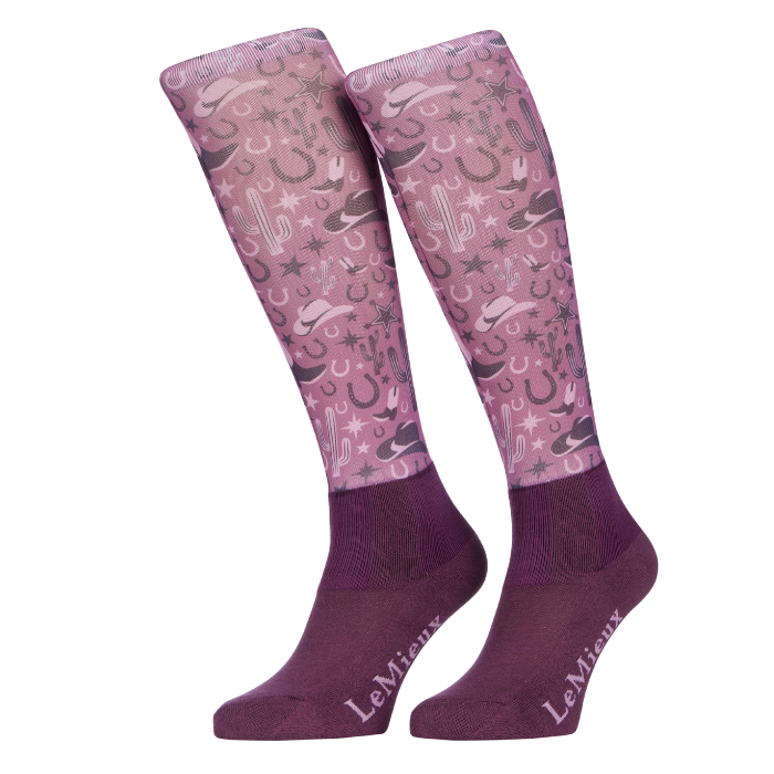 Pair of pink knee-high socks with cactus and western pattern on a white background