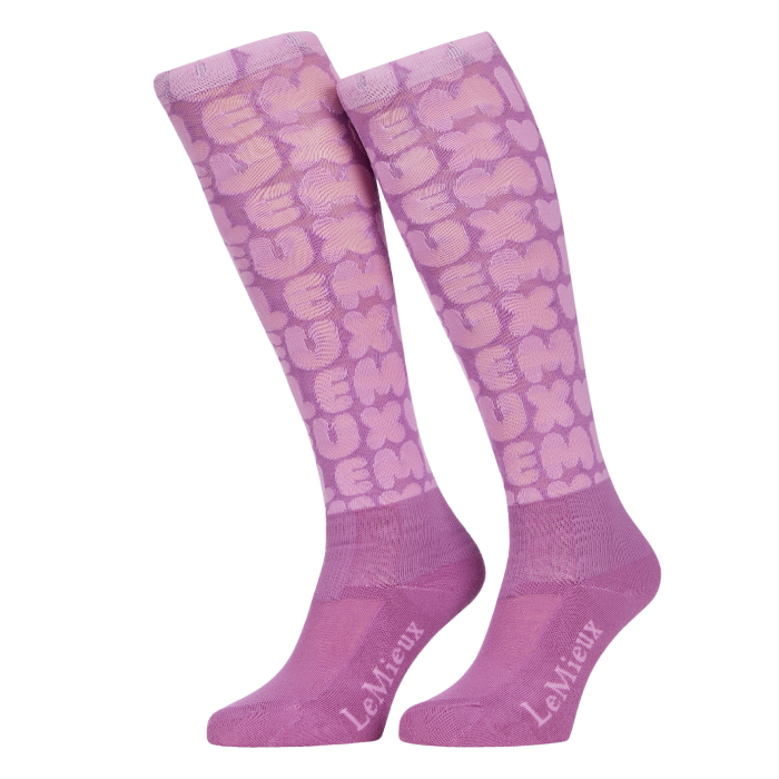 Pair of pink knee-high socks with a pattern on a white background