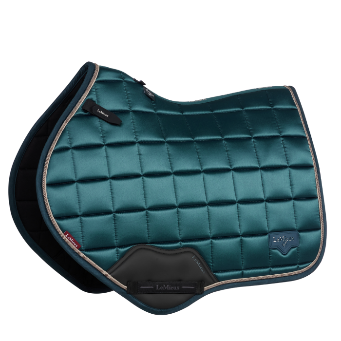 Rich green glossy horse saddle pad on a white background