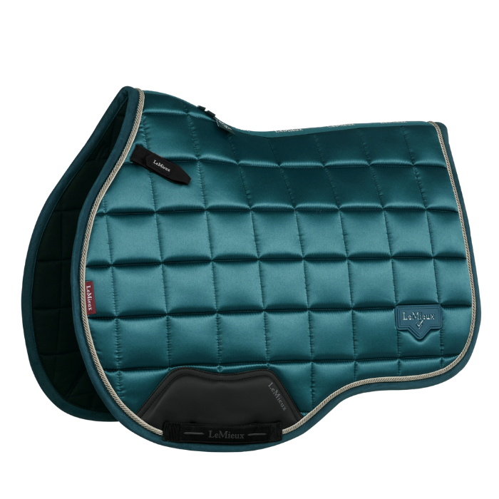 Rich green glossy saddle pad on a white background