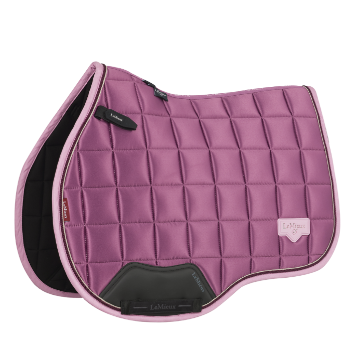 Pink glossy saddle pad on a white background