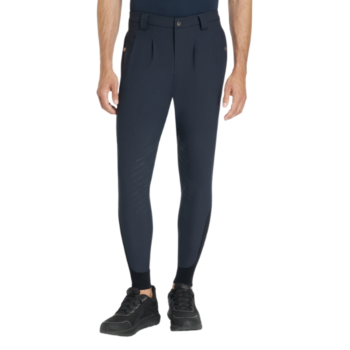 Man wearing navy equestrian breeches on a white background