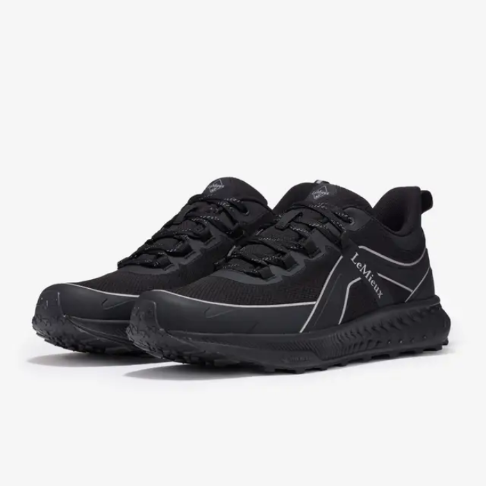 Black athletic shoes with a brand logo on a white background
