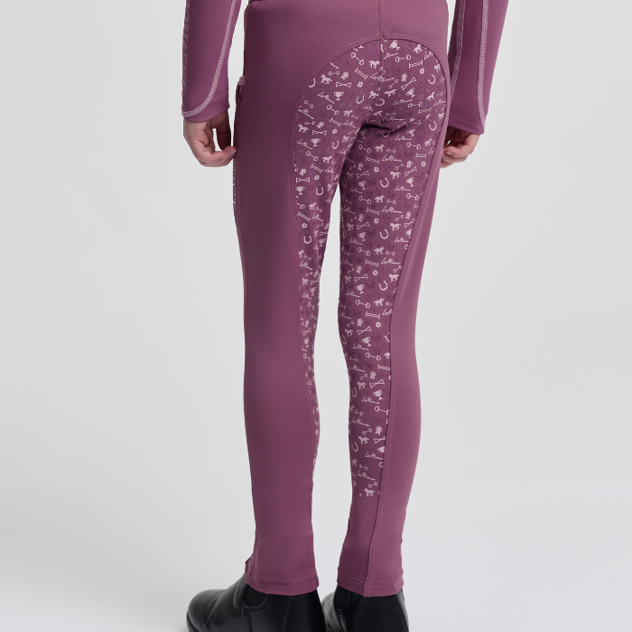 Pink leggings with an equestrian themed pattern on a white background