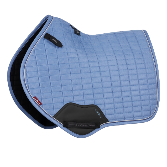 Blue quilted saddle pad with black accents on a white background