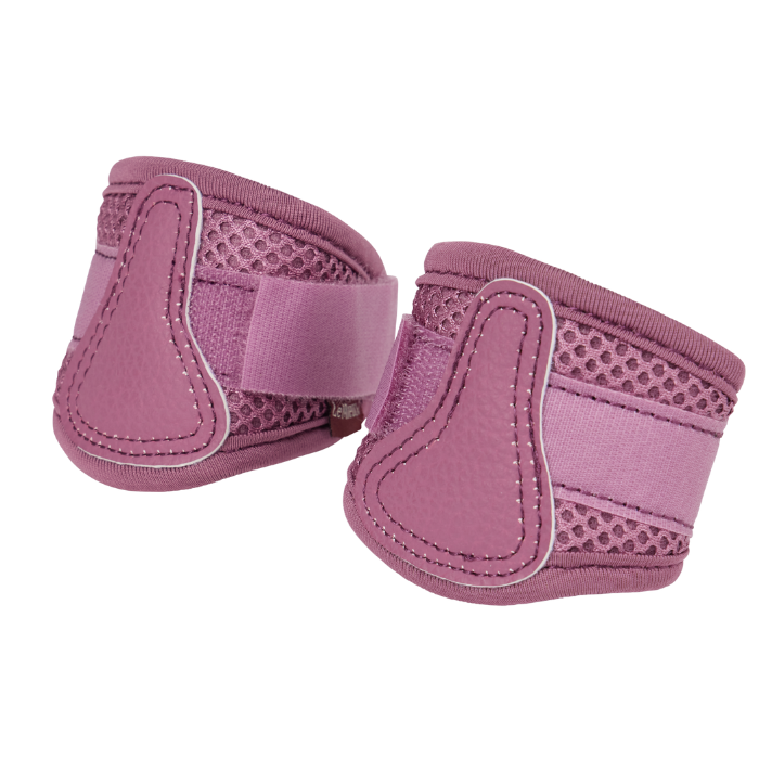 Pair of pink horse boots on a white background