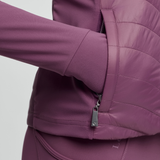 Close-up of a pink jacket with a zipper on a light grey background