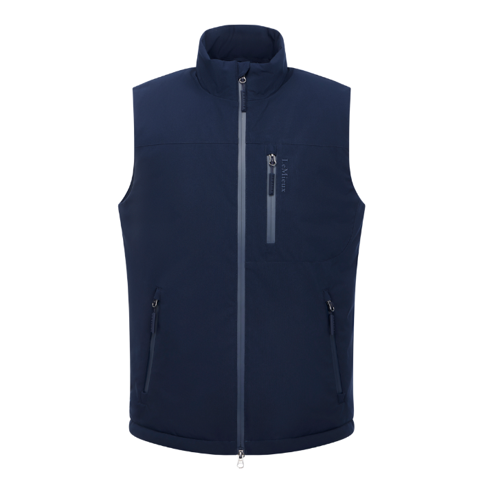 LeMieux AW26 Mens Midweight Insulated Gilet Varient Navy. A navy blue sleeveless zip-up vest with a stand-up collar, a vertical zippered chest pocket, and two zippered hand pockets, shown on a plain white background.