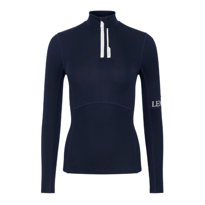 LeMieux AW26 Matilda Mid Layer Variant Colour Navy.
A dark navy blue long-sleeve quarter-zip performance top with a white zipper and a white LEANDER logo on the left sleeve, shown on a plain white background.