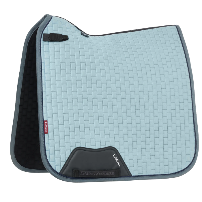 Light blue saddle pad with black accents on a white background