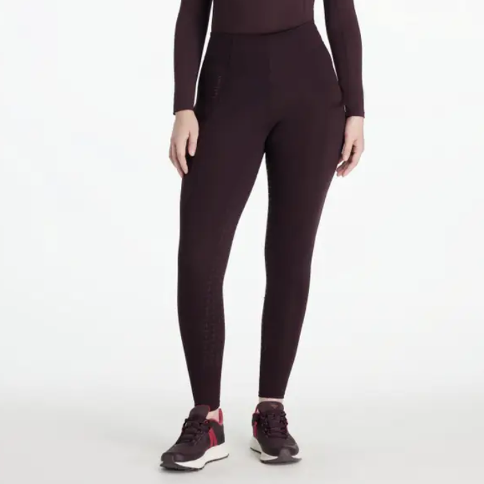 Dark puple riding leggings with trainers on a grey background