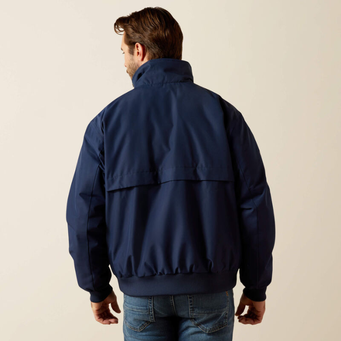 Man wearing a navy blue jacket on a beige background